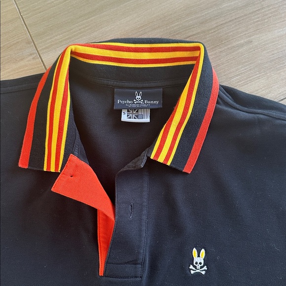 Psycho Bunny Black Polo with Red and Yellow Striped Collar - Picture 1 of 2